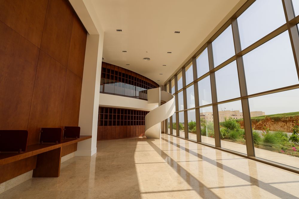 Ground-floor gallery, oak bench seating and full-height glazing