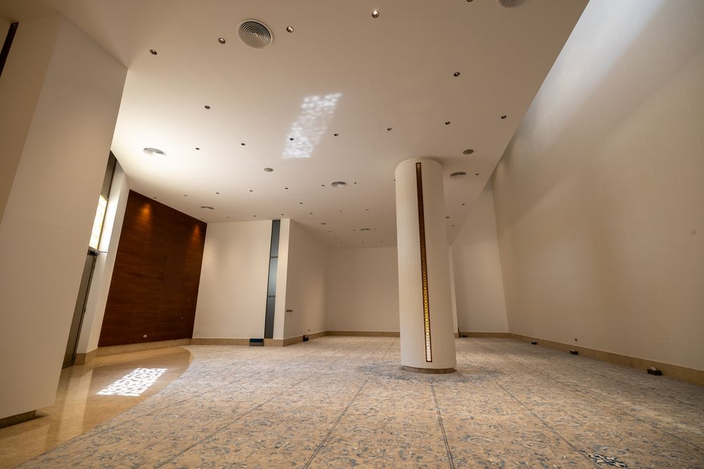 Prayer hall — sculpted column and inlaid stone floor
