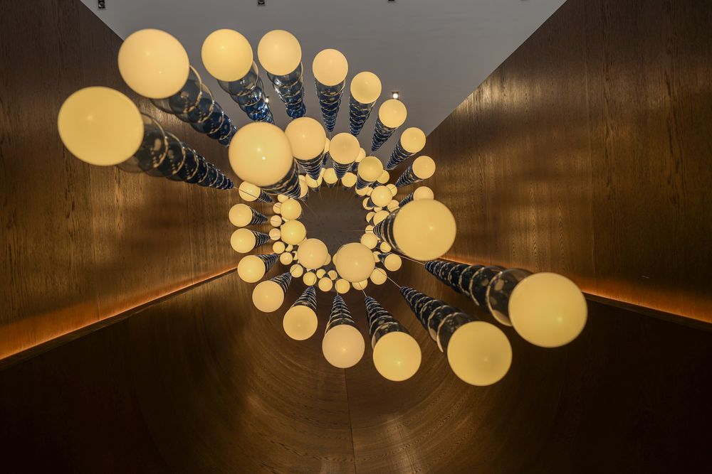 Light installation from below — radial glass and opal globes