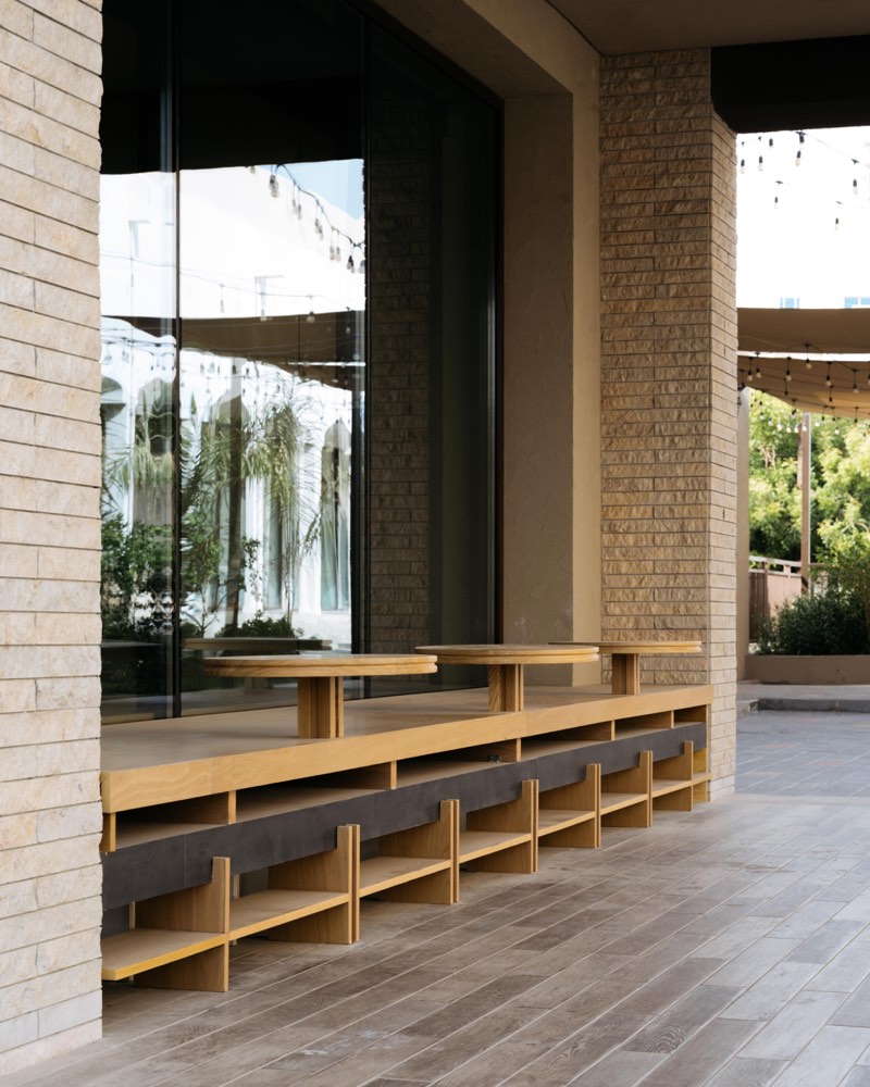 Timber window bench running the length of the arcade