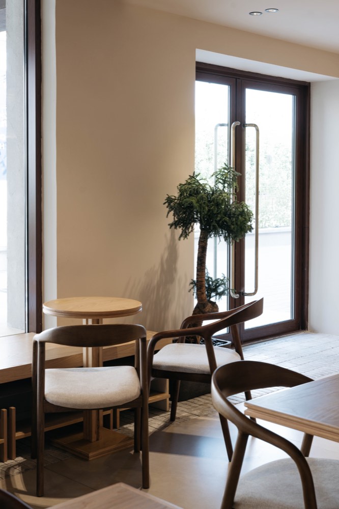 Window seating framed by dark timber doors