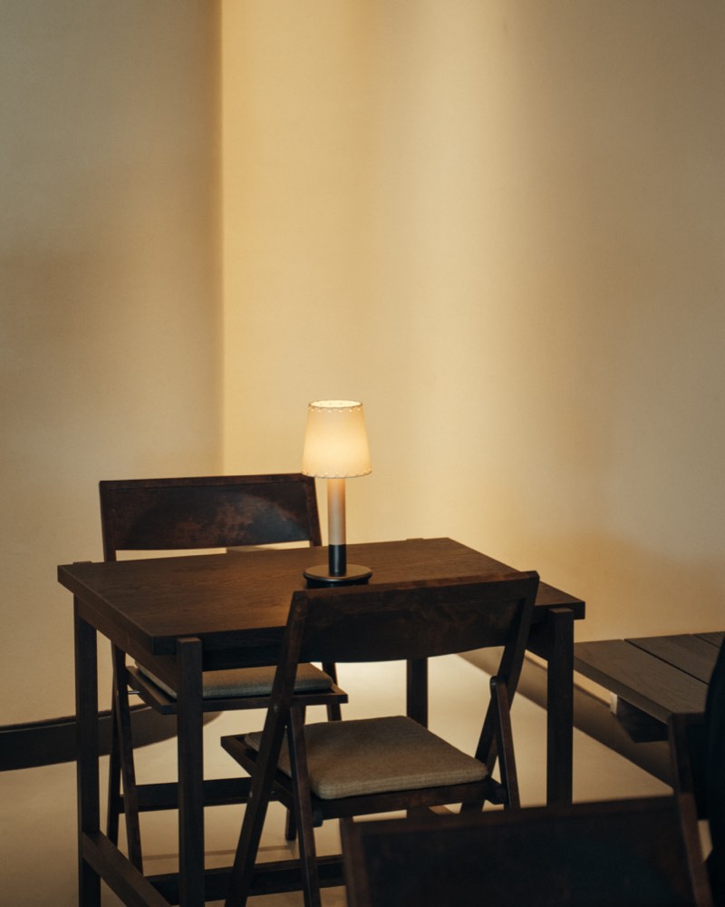 Evening corner in dark timber and lamplight