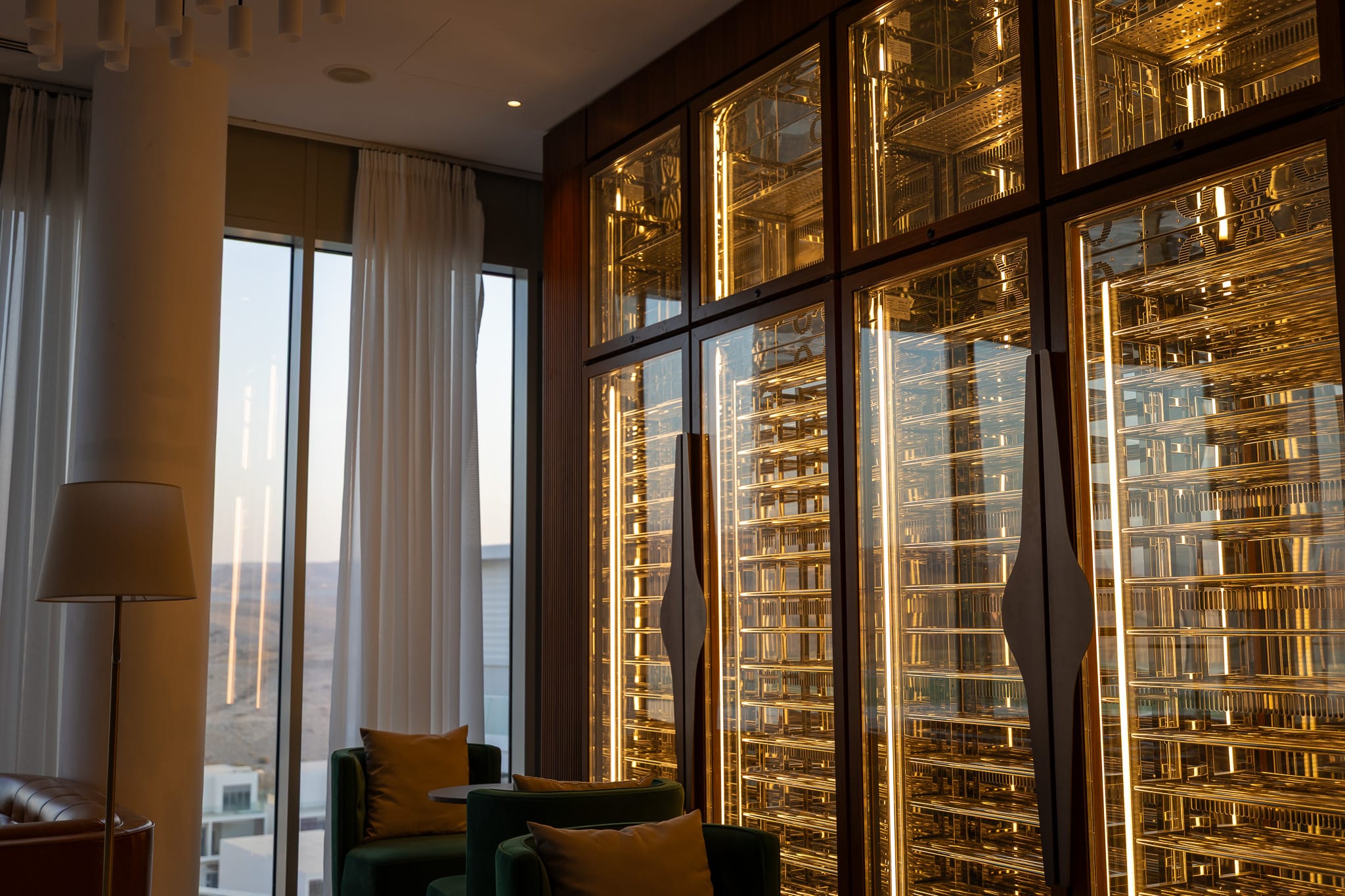 Backlit brass wine wall